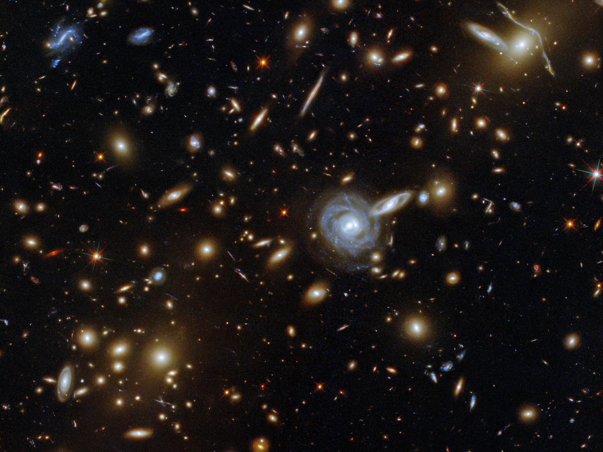 May's image is of a massive galaxy cluster named ACO S 295 and you can see countless galaxies of all shapes and sizes. Credit: ESA/Hubble & NASA, F. Pacaud, D. Coe