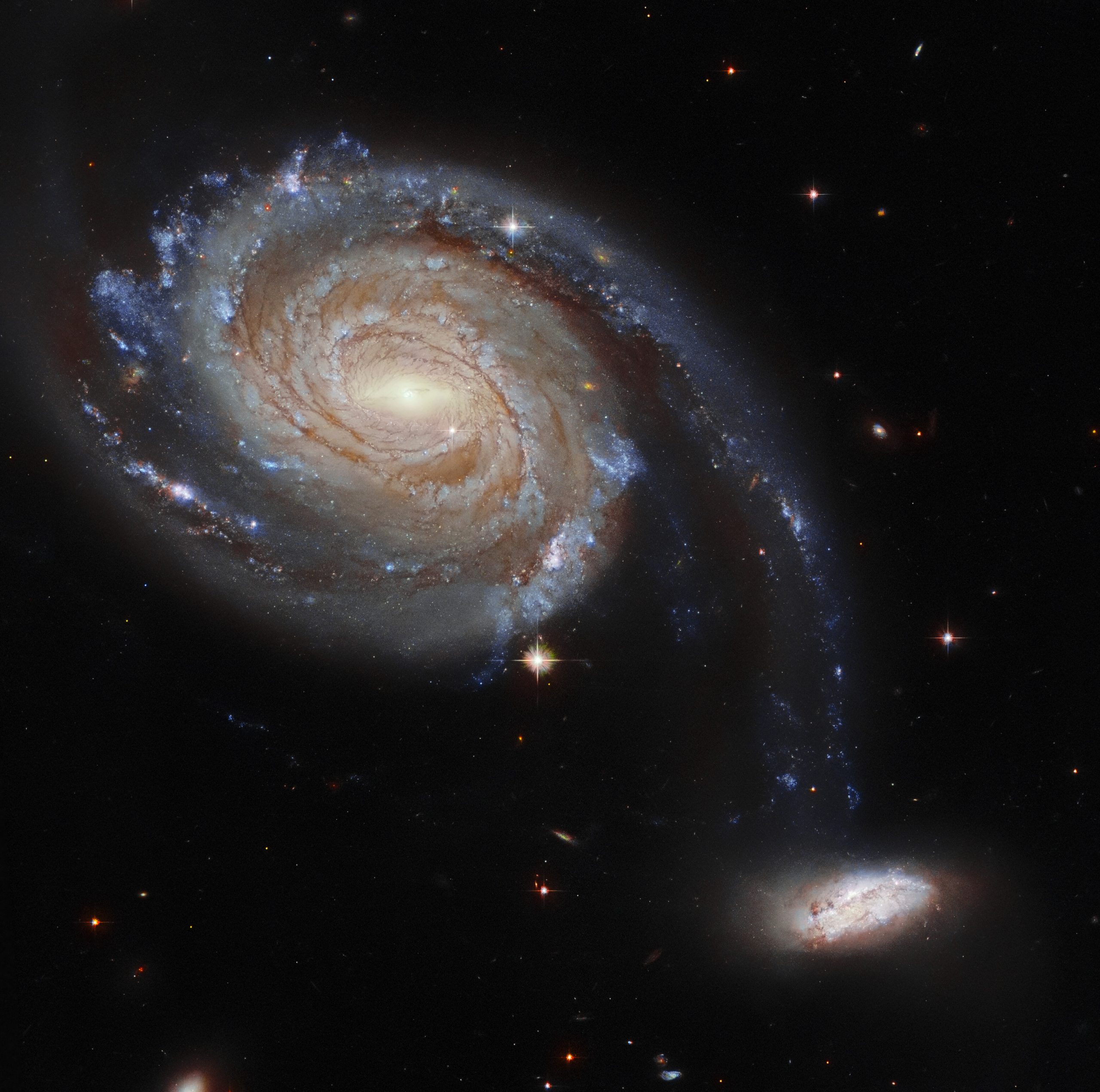 March includes an image of a pair of interacting galaxies called Apr 86, located 220 million light-years away. Credit: ESA/Hubble and NASA, Dark Energy Survey, J. Dalcanton