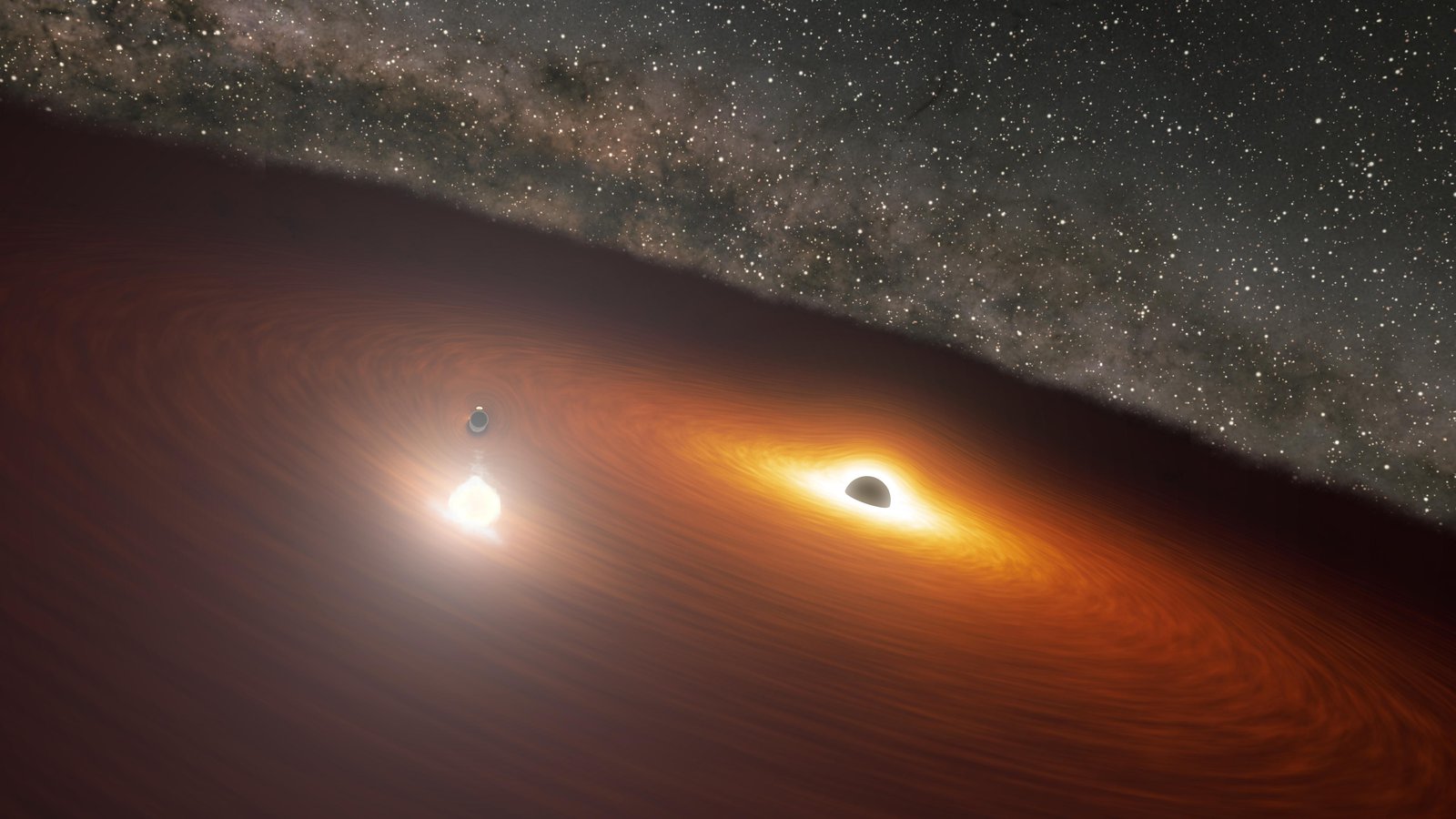 There are two supermassive black holes in the OJ 287 galaxy. Credit: NASA/JPL-Caltech