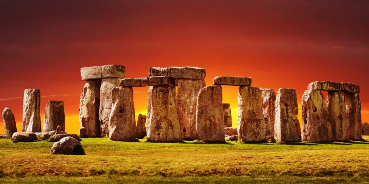 A photograph of Stonehenge at sunset. Image Credit: Depositphotos.