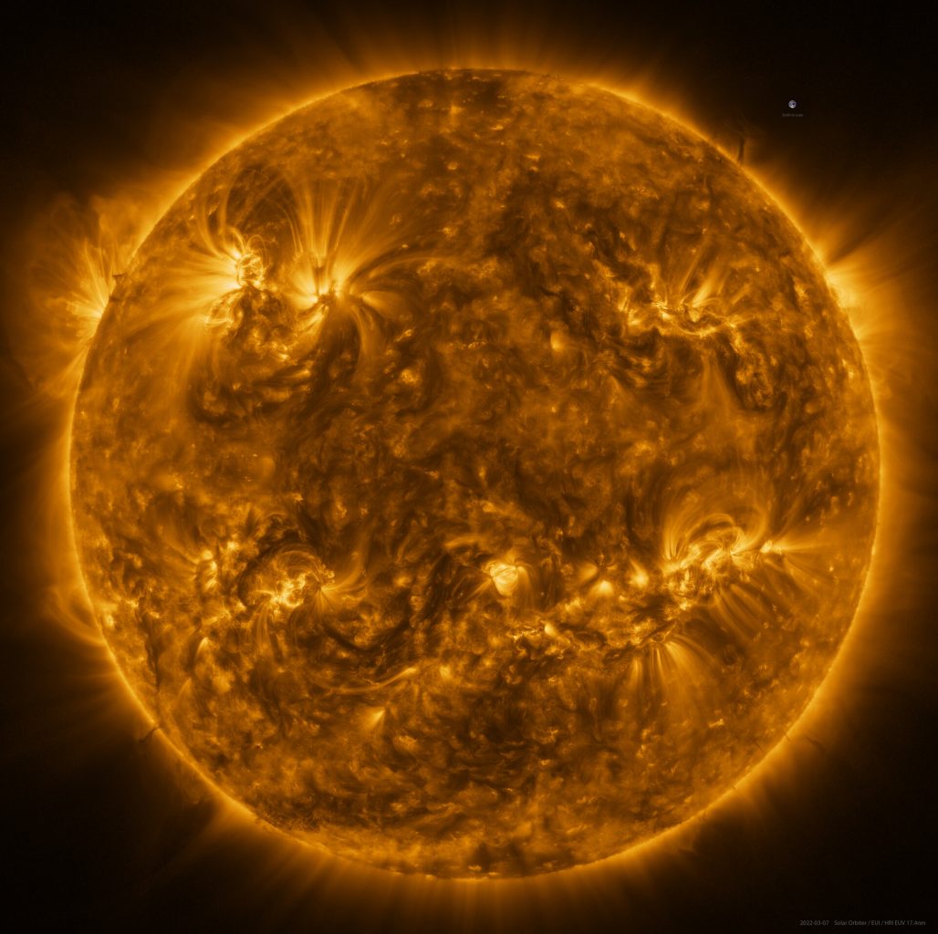 EUI mosaic image of the Sun. The earth is inserted for scale. Credit: ESA, NASA, G. Pelouze / IAS