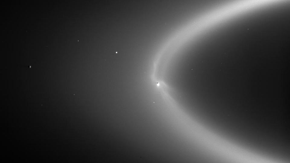 Enceladus and the E-ring. Credit: NASA/JPL