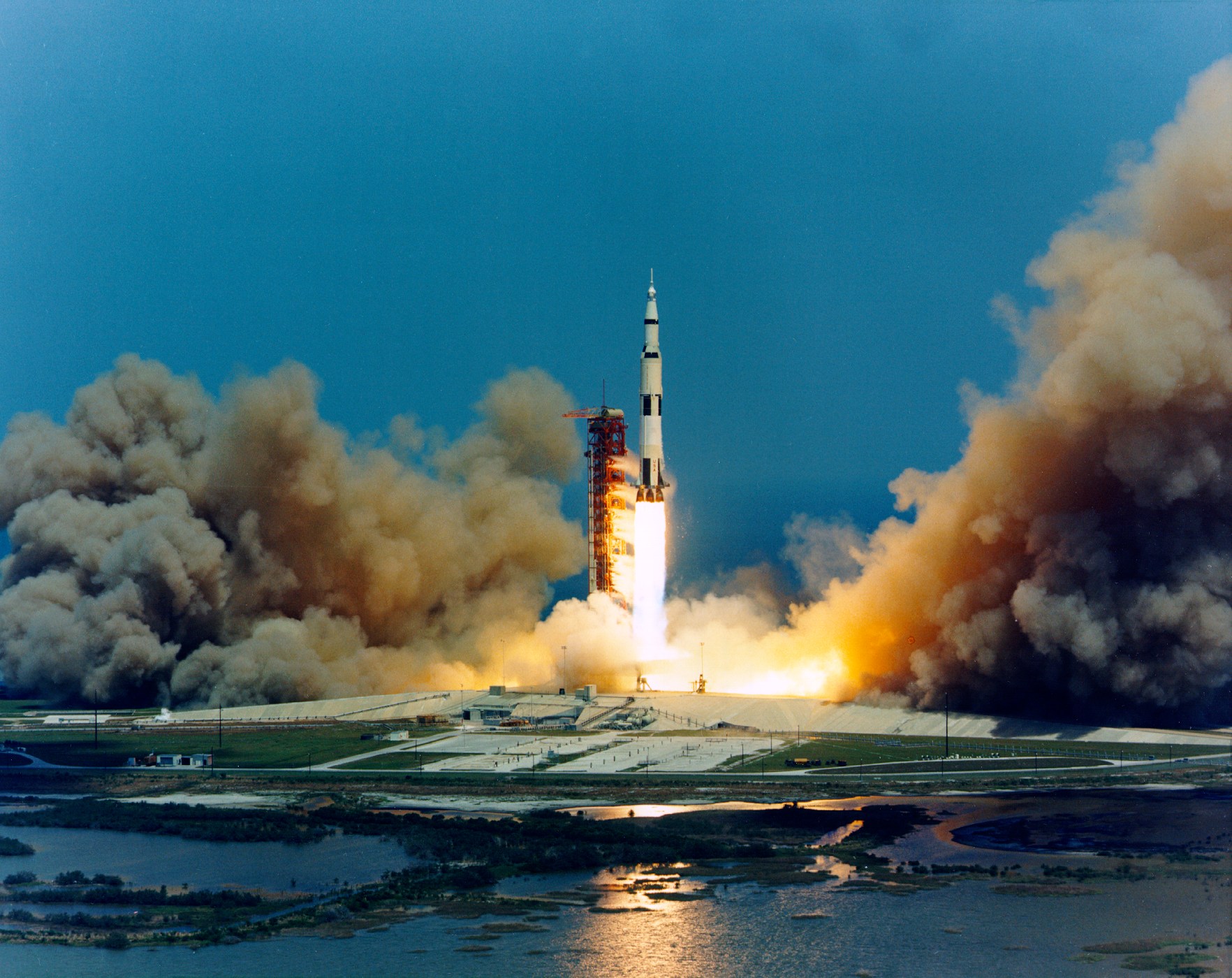 This photograph shows the lift-off of Apollo 16 on April 16, 1972. The crew was launched into space atop a Saturn V rocket, designated as AS-511. NASA.