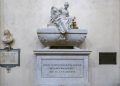 FLORENCE, TUSCANY/ITALY. Monument to Niccolo di Bernardo dei Machiavelli in Santa Croce Church in Florence. Depositphotos.