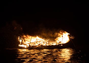 An ancient ship on fire. Greek fire weapon. Depositphotos.