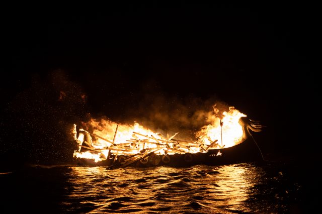 An ancient ship on fire. Greek fire weapon. Depositphotos.