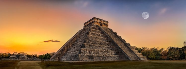 The ancient Maya pyramid of Chichen Itza at sunset. Depositphotos.