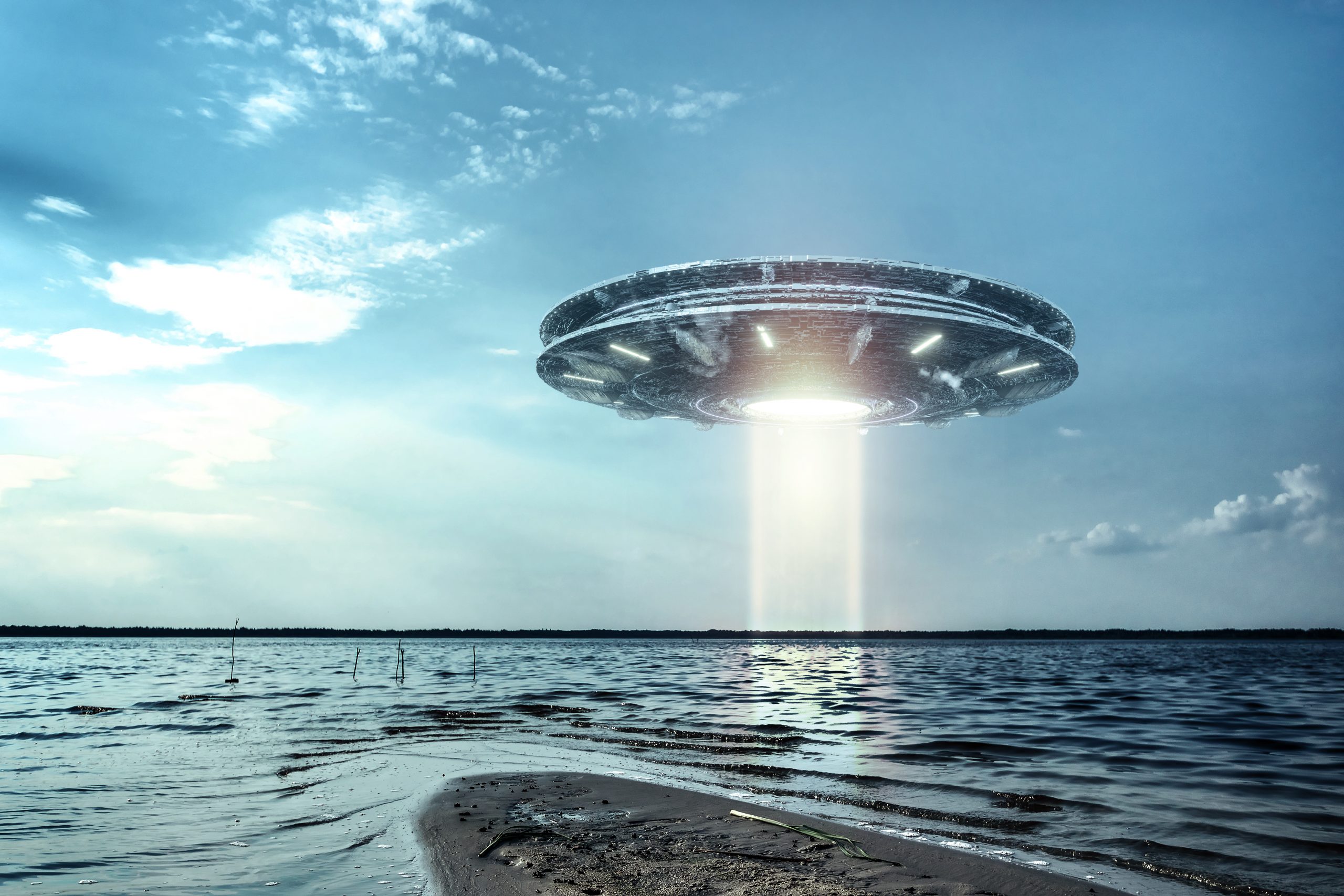 An artistic rendering of a UFO hovering in the sky. Depositphotos.