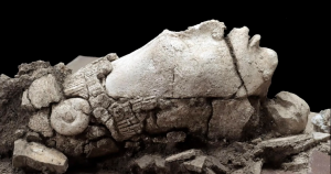 A photograph of the statue showing an elongate s head of Nal, the ancient Maya Maize God. Gibrán Huerta / INAH.