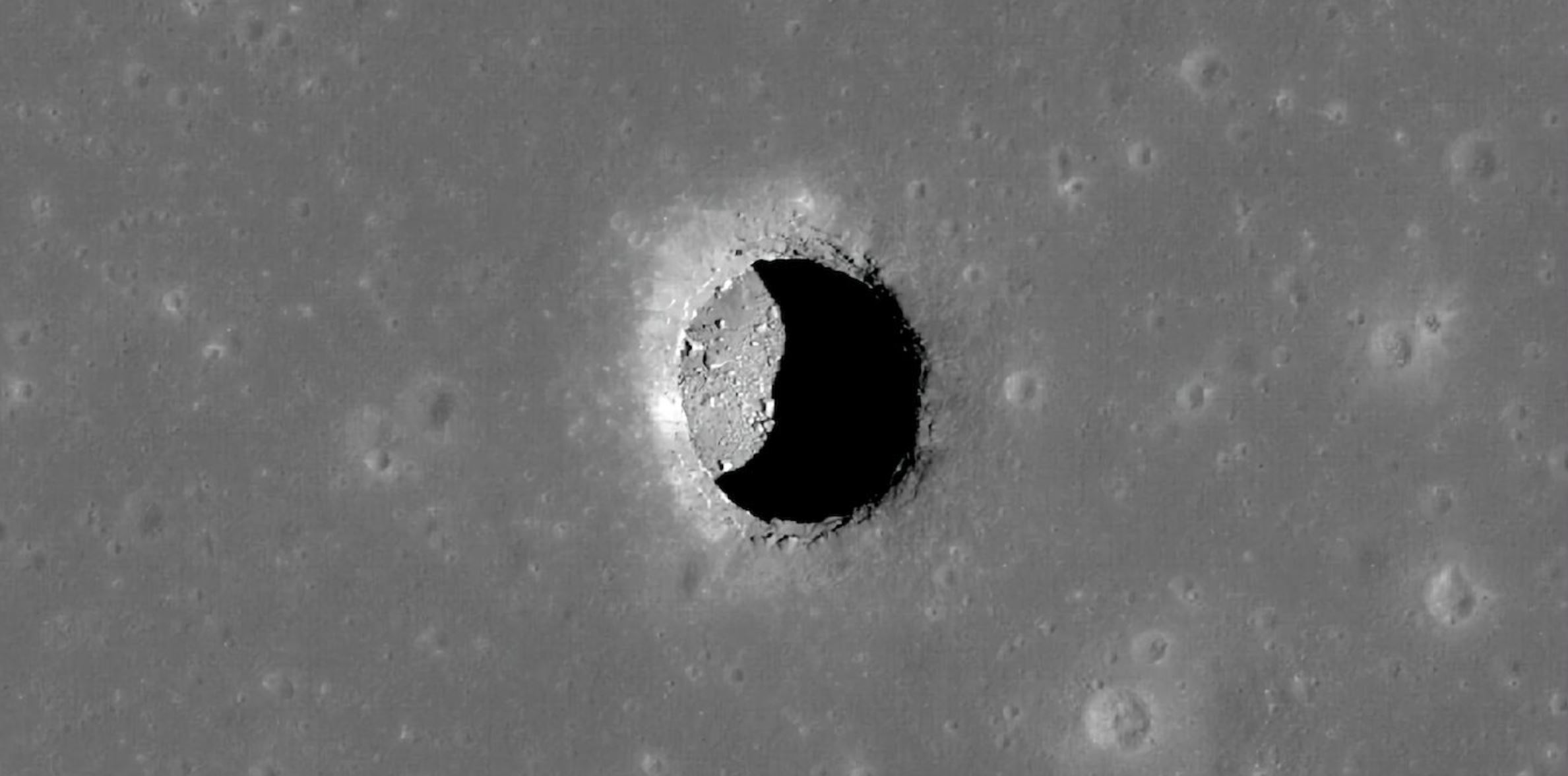 A pit on the surface of the Moon. Image Credit: NASA/GSFC/Arizona State University.