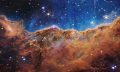 An edge of young, star-forming regions called NGC 3324 in the Carina Nebula can be seen in front of these "mountains" and "valleys," speckled with glittering stars. For the first time, NASA's new James Webb Space Telescope is capturing infrared images to reveal previously invisible star birth areas. Image Credits: NASA, ESA, CSA, and STScI