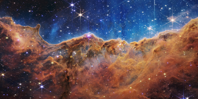 An edge of young, star-forming regions called NGC 3324 in the Carina Nebula can be seen in front of these "mountains" and "valleys," speckled with glittering stars. For the first time, NASA's new James Webb Space Telescope is capturing infrared images to reveal previously invisible star birth areas. Image Credits: NASA, ESA, CSA, and STScI