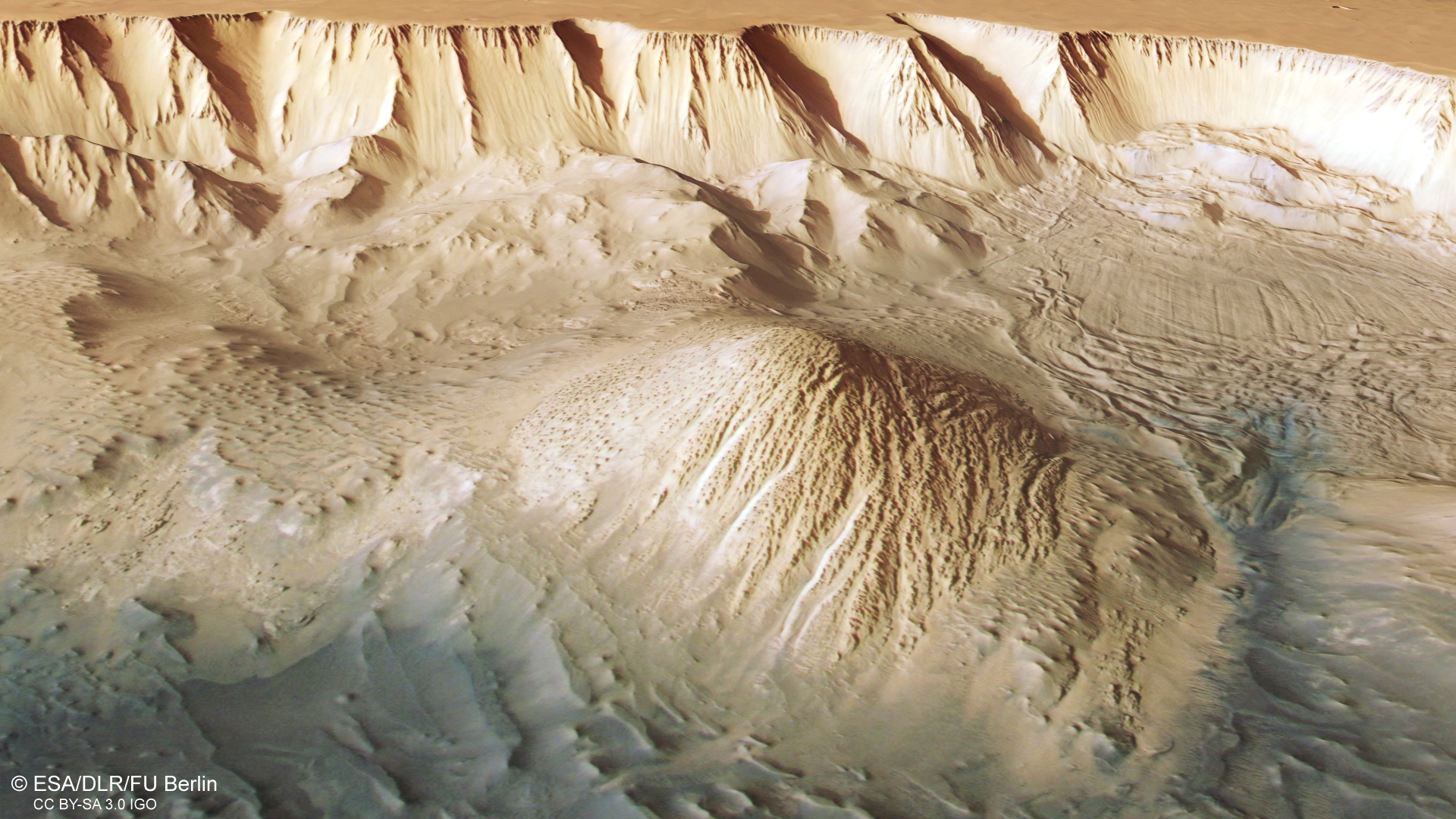 A digital terrain model and the nadir and colour channels of the High Resolution Stereo Camera on the Mars Express were used to create this oblique perspective view of Tithonium Chasmata, which is part of Mars' Valles Marineris canyon structure. ESA/DLR/FU Berlin, CC BY-SA 3.0 IGO.