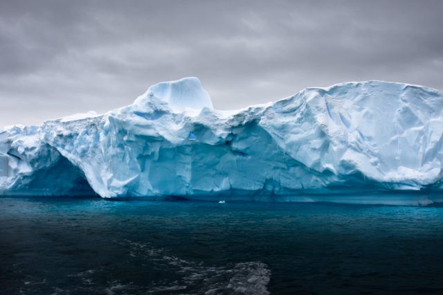 A photograph of an iceberg in Antarctica. Depositphotos.