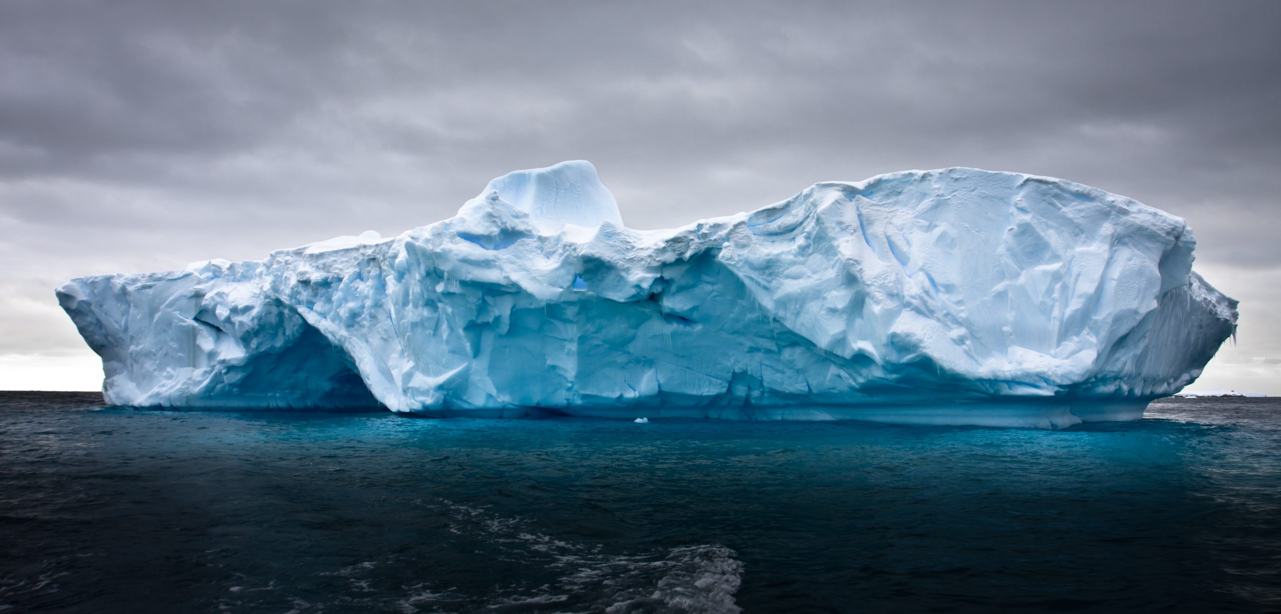 A photograph of an iceberg in Antarctica. Depositphotos.
