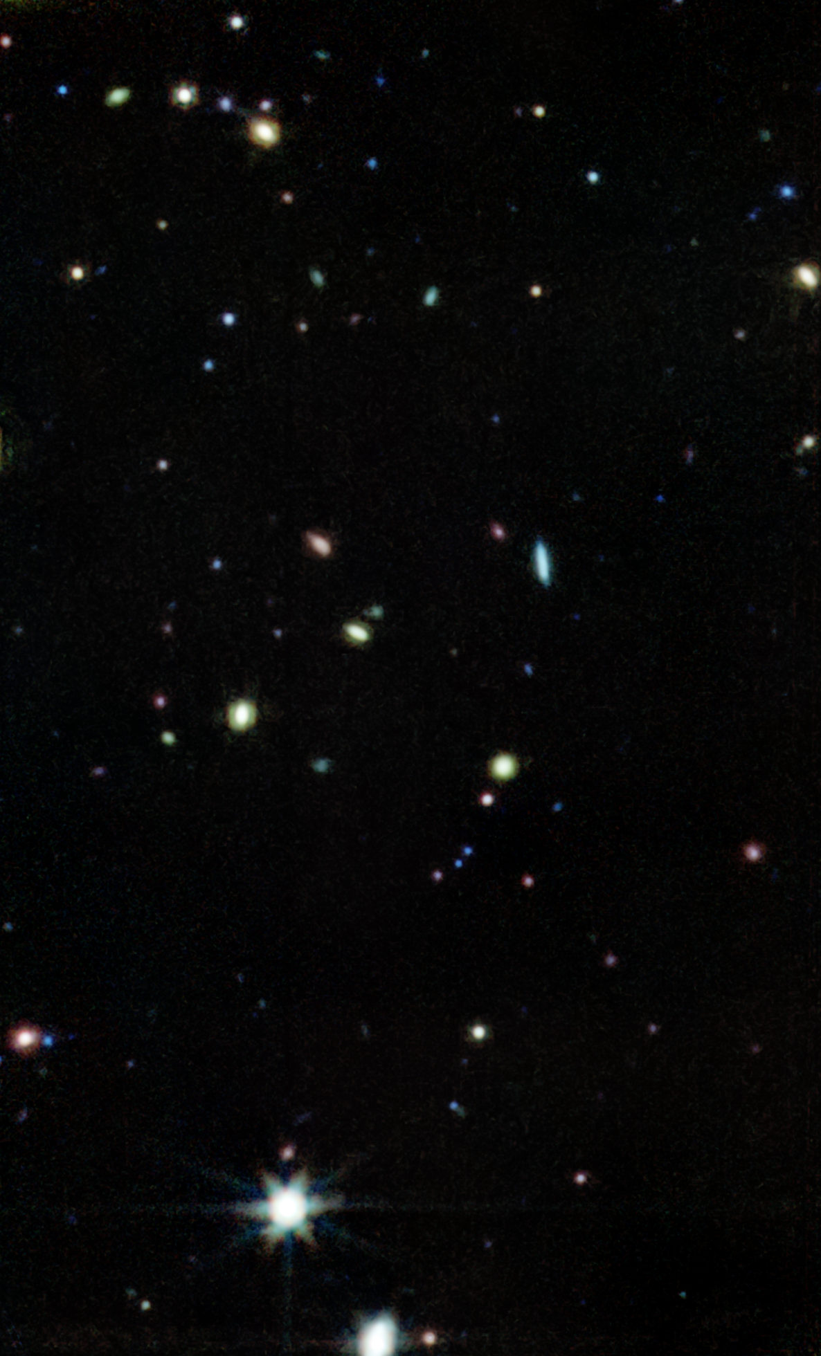 This is a photograph taken with MIRI, the Mid-Infrared Instrument. A region of the sky is visible close to the tail of the Big Dipper. The image revealed how galaxies in dense interstellar gas and dust form new stars, which can be difficult to study with optical telescopes such as Hubble. It's one of the first images produced by the CEERS collaboration. Image Credit: NASA; STScI; CEERS; TACC; S. Finkelstein; G. Yang; C. Papovich; Z. Leva.