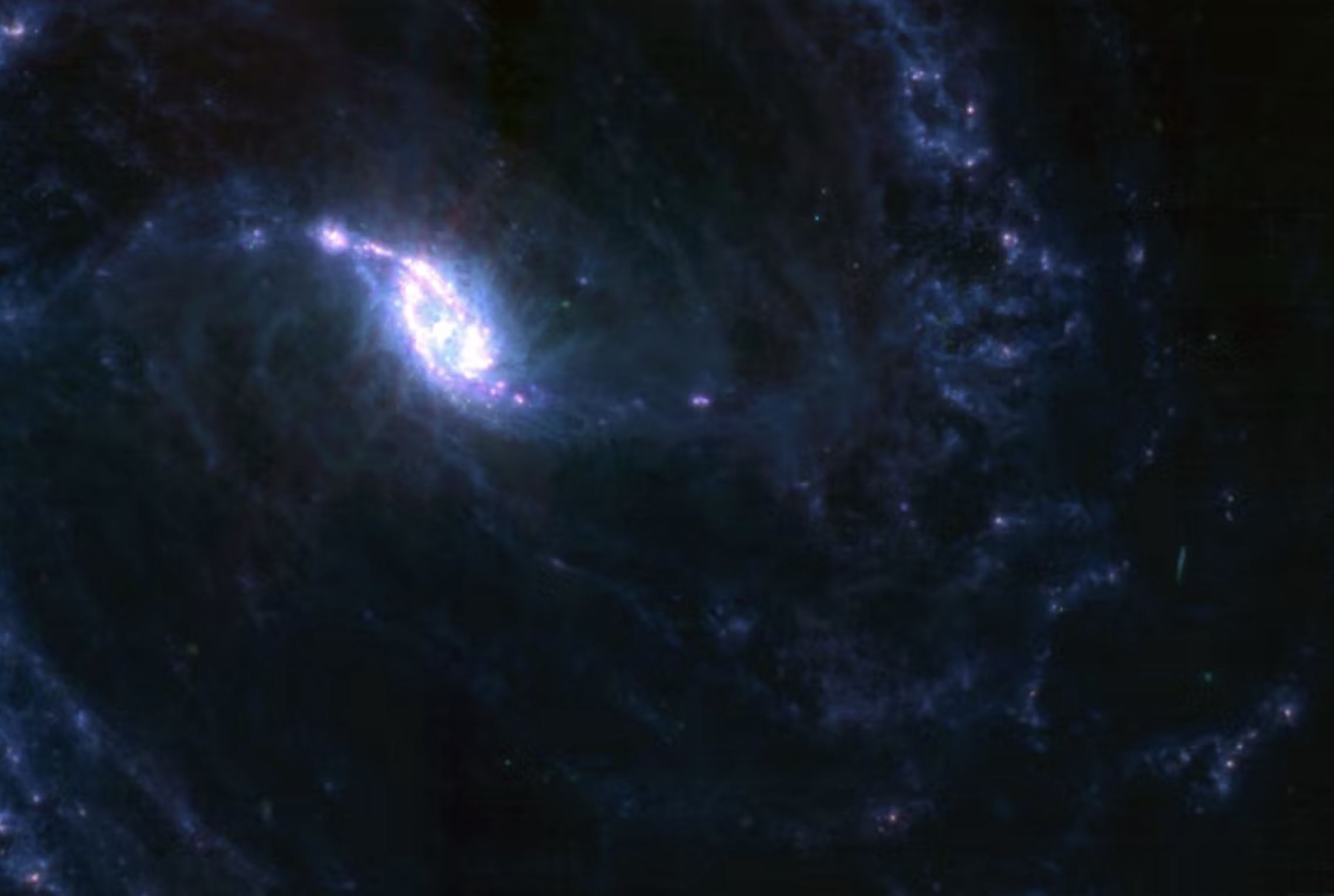 A photograph of NGC 1365 taken by the James Webb MIRI instrument. This image shows a longer-wavelength mid-infrared view. Image Credit: NASA, ESA, CSA, STScI. Processed by: u/SpaceGuy44.