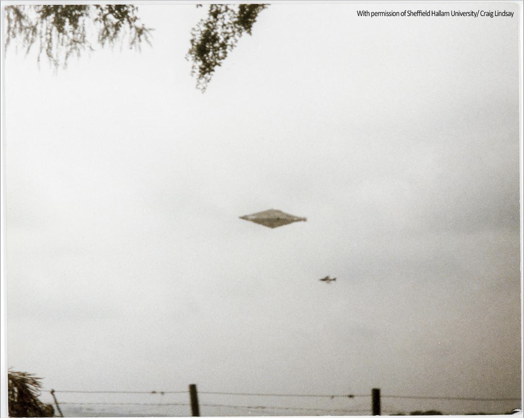 One of the Calvine UFO photographs clearly showing a diamond-shaped craft, and an airplane in the distance. Image Credit: Sheffield Hallam University/Craig Lindsay.
