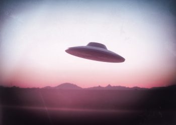 An illustration of a UFO flying saucer. Depositphotos.