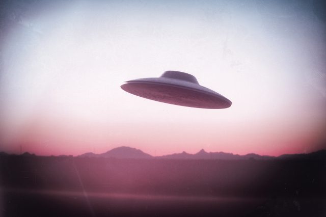 An illustration of a UFO flying saucer. Depositphotos.