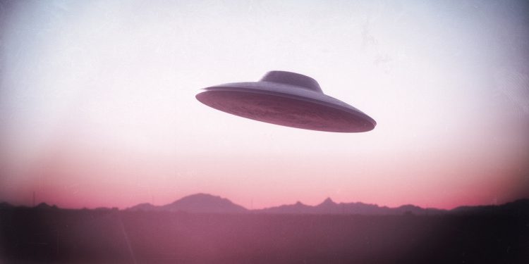 An illustration of a UFO flying saucer. Depositphotos.