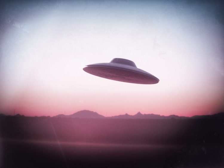 An illustration of a UFO flying saucer. Depositphotos.