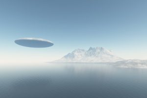 An illustration showing a UFO flying over the ocean. Depositphotos.
