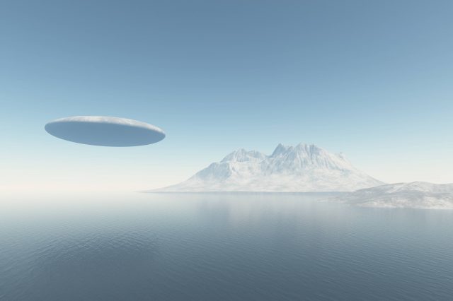An illustration showing a UFO flying over the ocean. Depositphotos.
