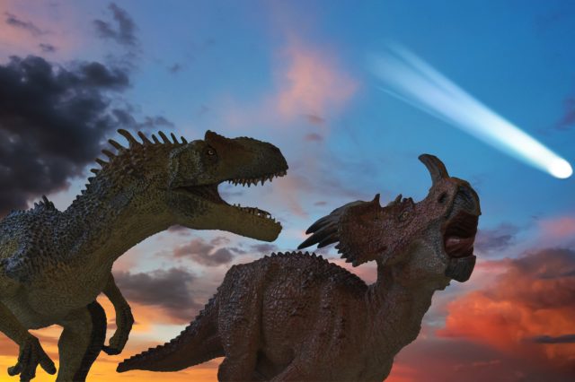 An illustration showing the asteroid impact and the dinosaurs. Depositphotos.