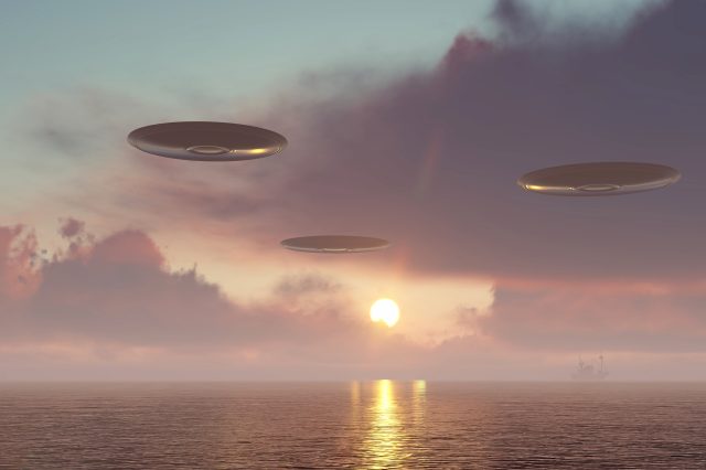 An artistic illustration of UFOs above Lake Michigan. Depositphotos.