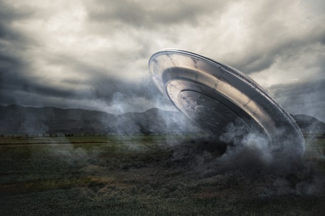 An illustration showing a crashed UFO. Depositphotos.