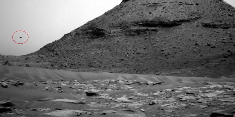 A photograph taken by the Curiosity over showing what appears to be a UFO. NASA.