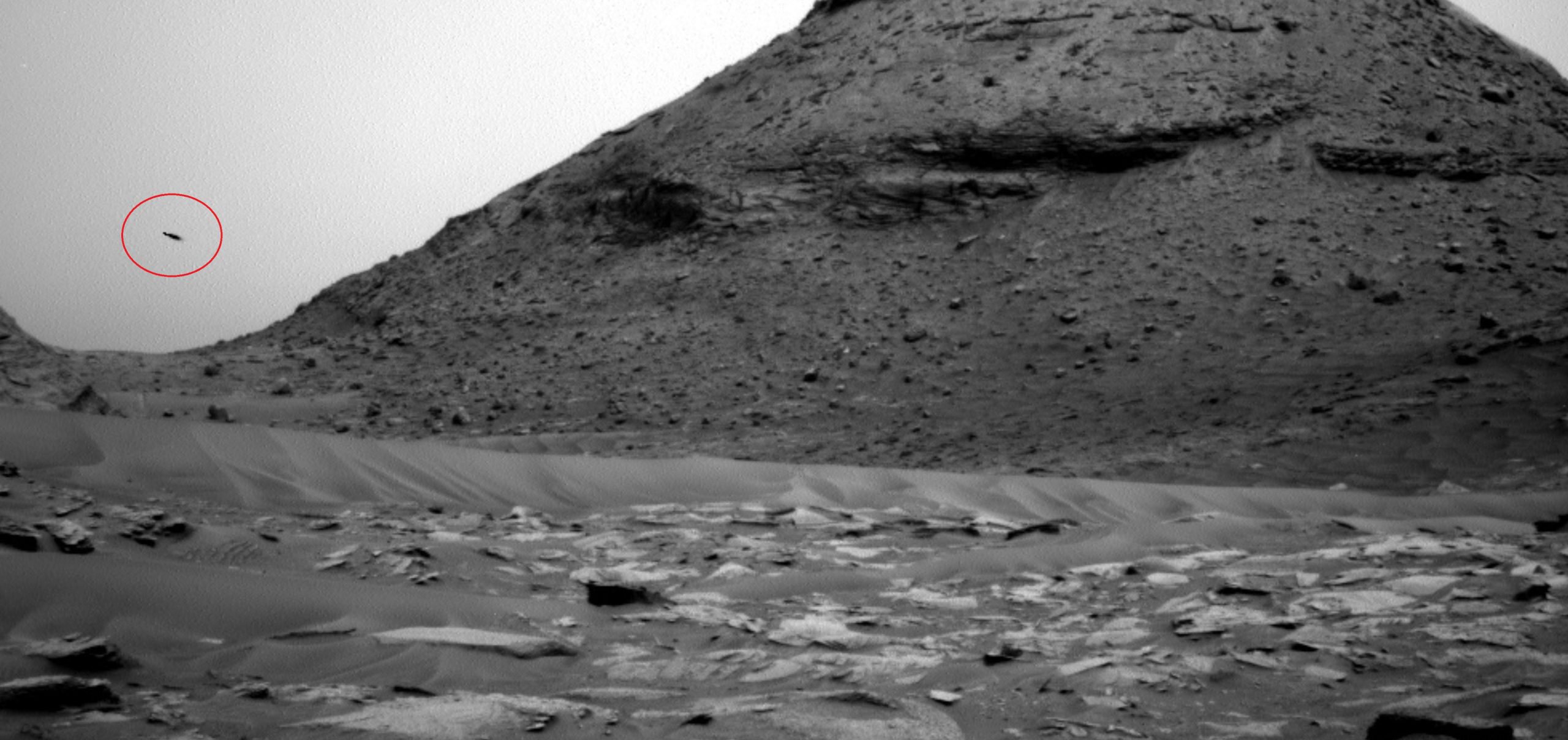 A photograph taken by the Curiosity over showing what appears to be a UFO. NASA.
