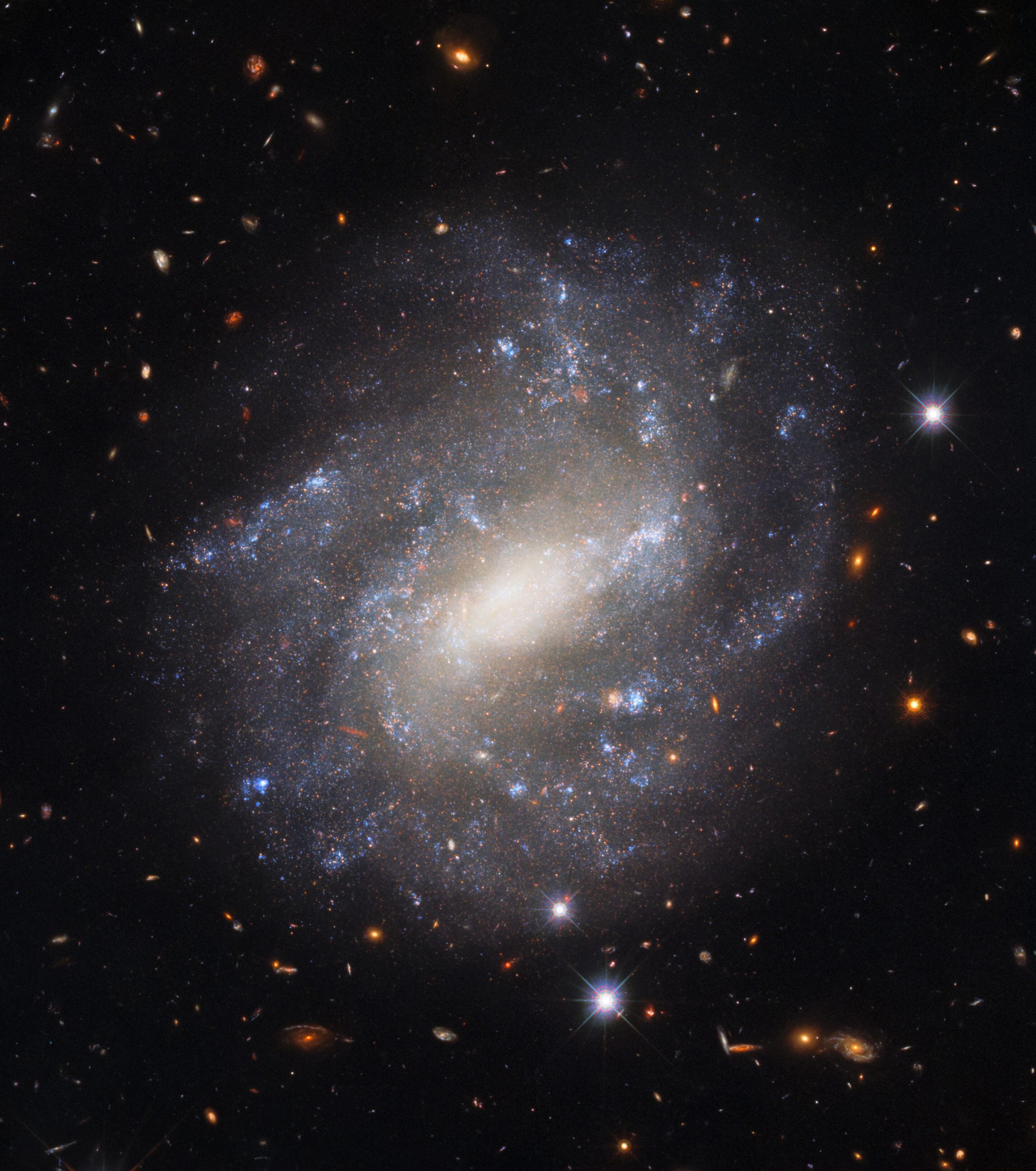 This stunning photograph taken by the Hubble Space Telescope shows UGC 9391, a galaxy located some 130 million light-years from Earth. Image Credit: Image credit: ESA/Hubble & NASA, A. Riess et al.