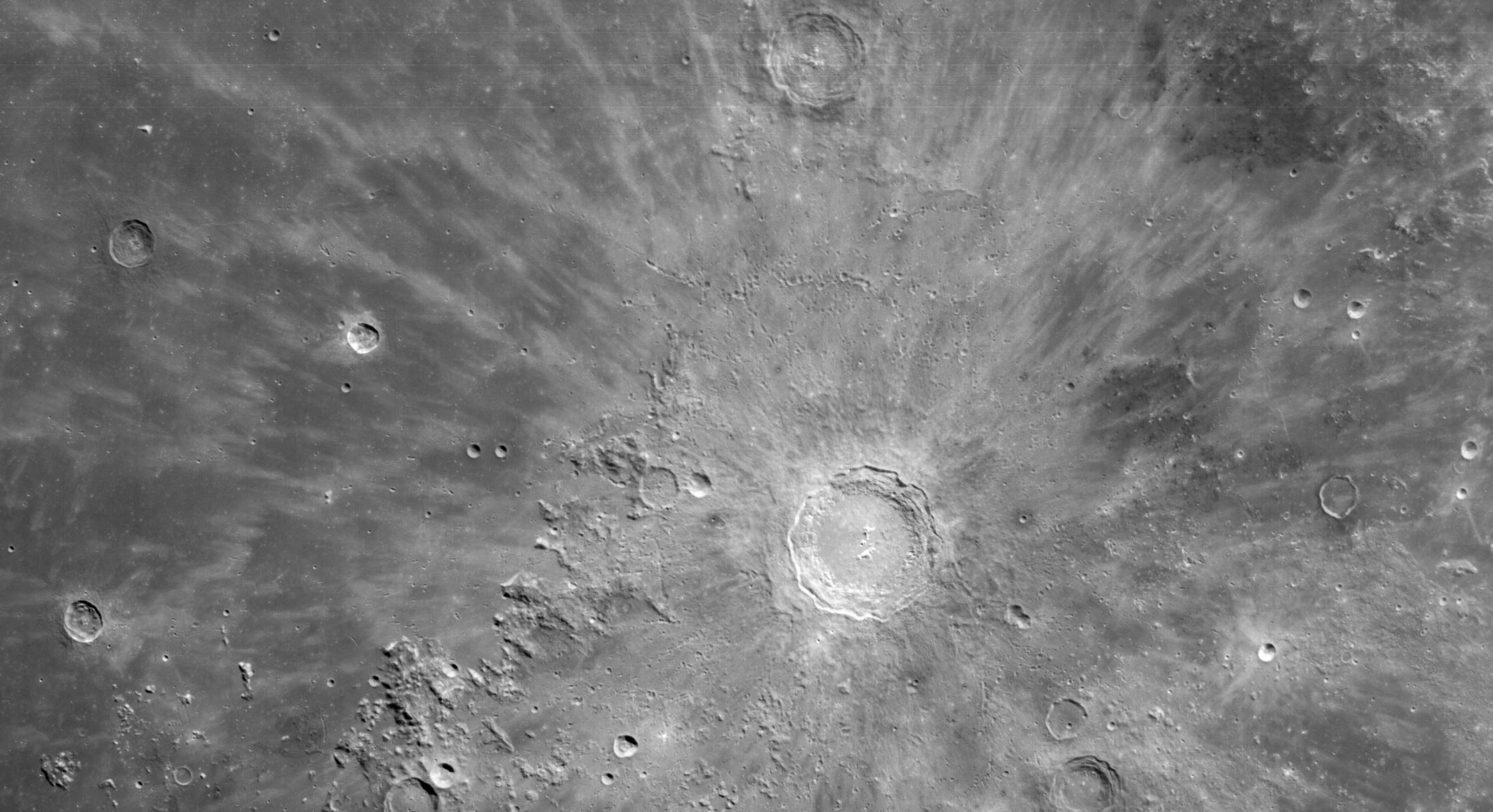 A cropped photograph of the Artemis I close-p view of the Moon. NASA.