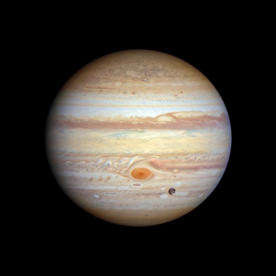 A view of Jupiter and Ganymede. NASA, ESA, STSCI, A. SIMON (NASA).