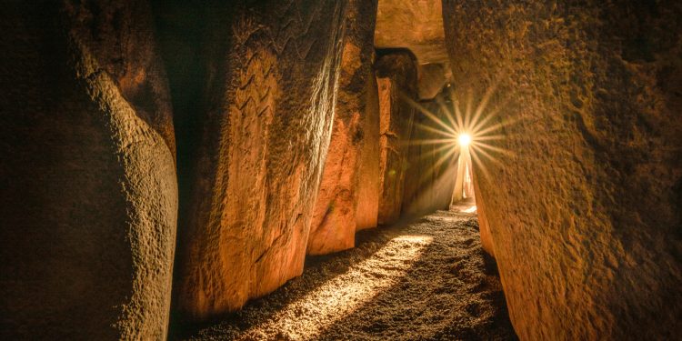 A photo inside Newgrange. Image Credit: KEN WILLIAMS/SHADOWSANDSTONE.COM