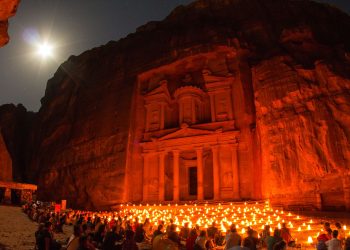 Tourists at Al-Khazneh, at night. Wikimedia commons.