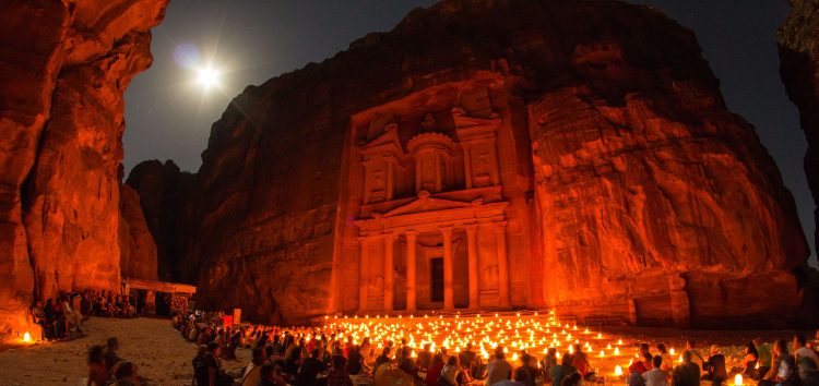 Tourists at Al-Khazneh, at night. Wikimedia commons.