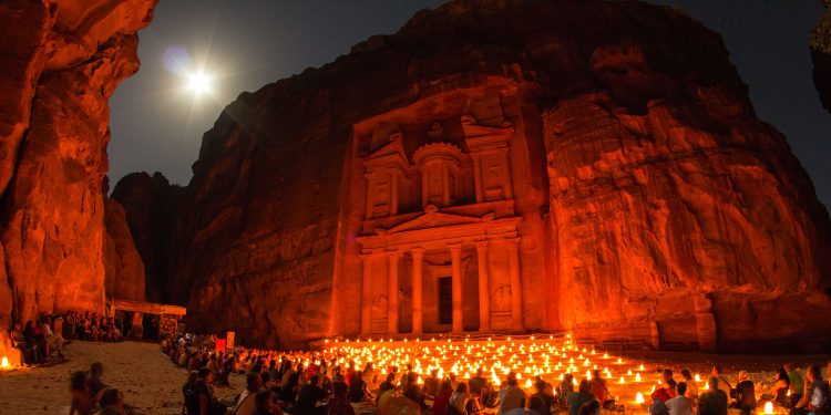 Tourists at Al-Khazneh, at night. Wikimedia commons.