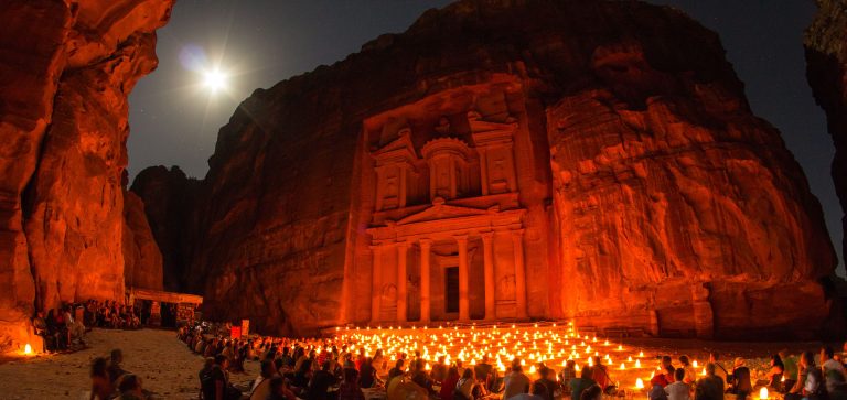 Tourists at Al-Khazneh, at night. Wikimedia commons.