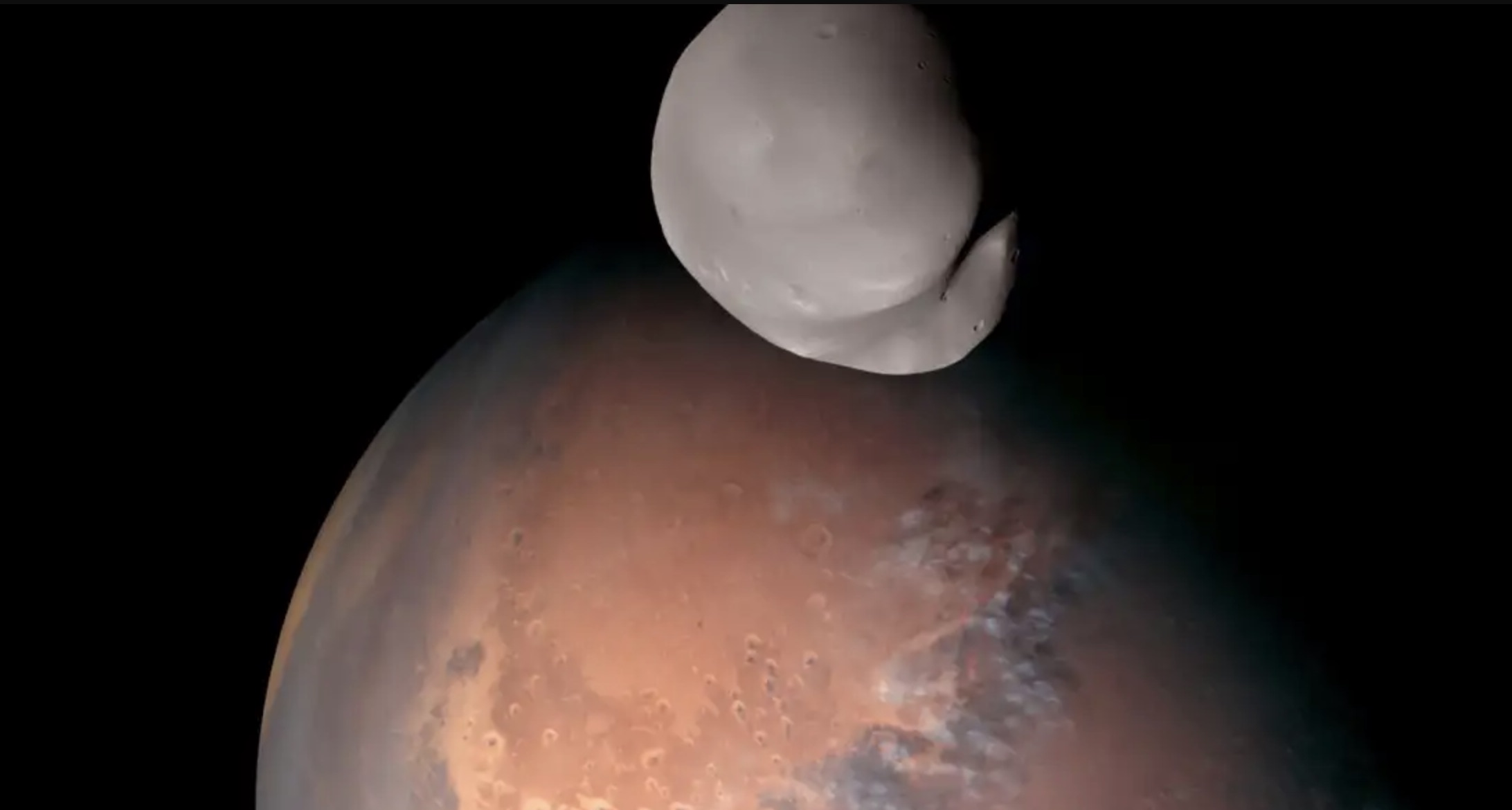 Photograph showing Mars and its moon Deimos. Emirates Mars Mission.