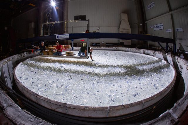 In September 2023, staff at the University of Arizona's Richard F. Caris Mirror Lab expertly positioned almost 20 tons of Ohara E6 low expansion glass into a casting mold, paving the way for the creation of the Giant Magellan Telescope's seventh primary mirror segment. Photo by Damien Jemison, courtesy of Giant Magellan Telescope—GMTO Corporation.