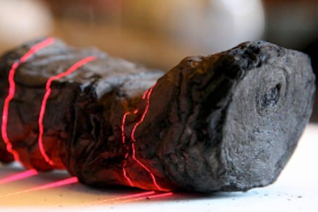 A sealed carbonized papyrus scroll from Herculaneum undergoing scanning. Credit: EduceLab/University of Kentucky.