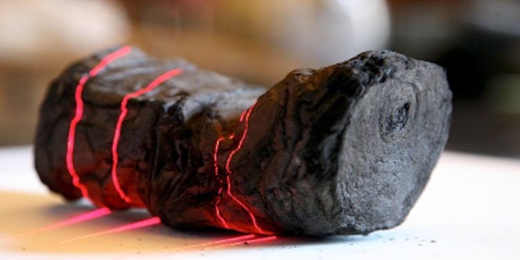 A sealed carbonized papyrus scroll from Herculaneum undergoing scanning. Credit: EduceLab/University of Kentucky.