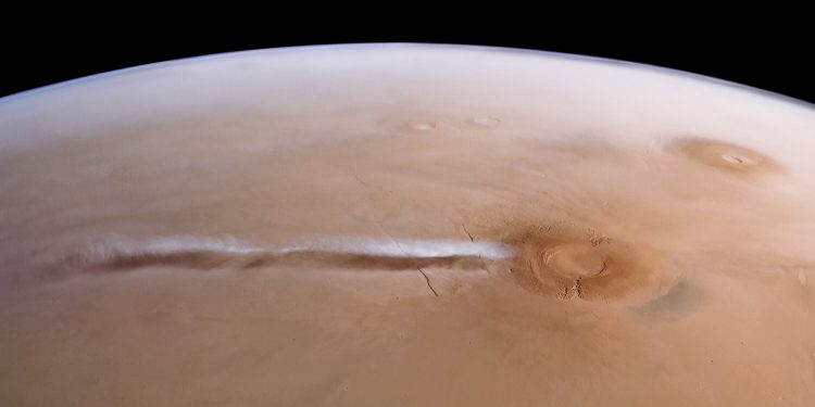 An elongated cloud has developed due to winds interacting with the Arsia Mons mountains. It forms nearly every day during a particular season, from the early morning hours until midday. Image credit: ESA/DLR/FU Berlin/A. Cowart.