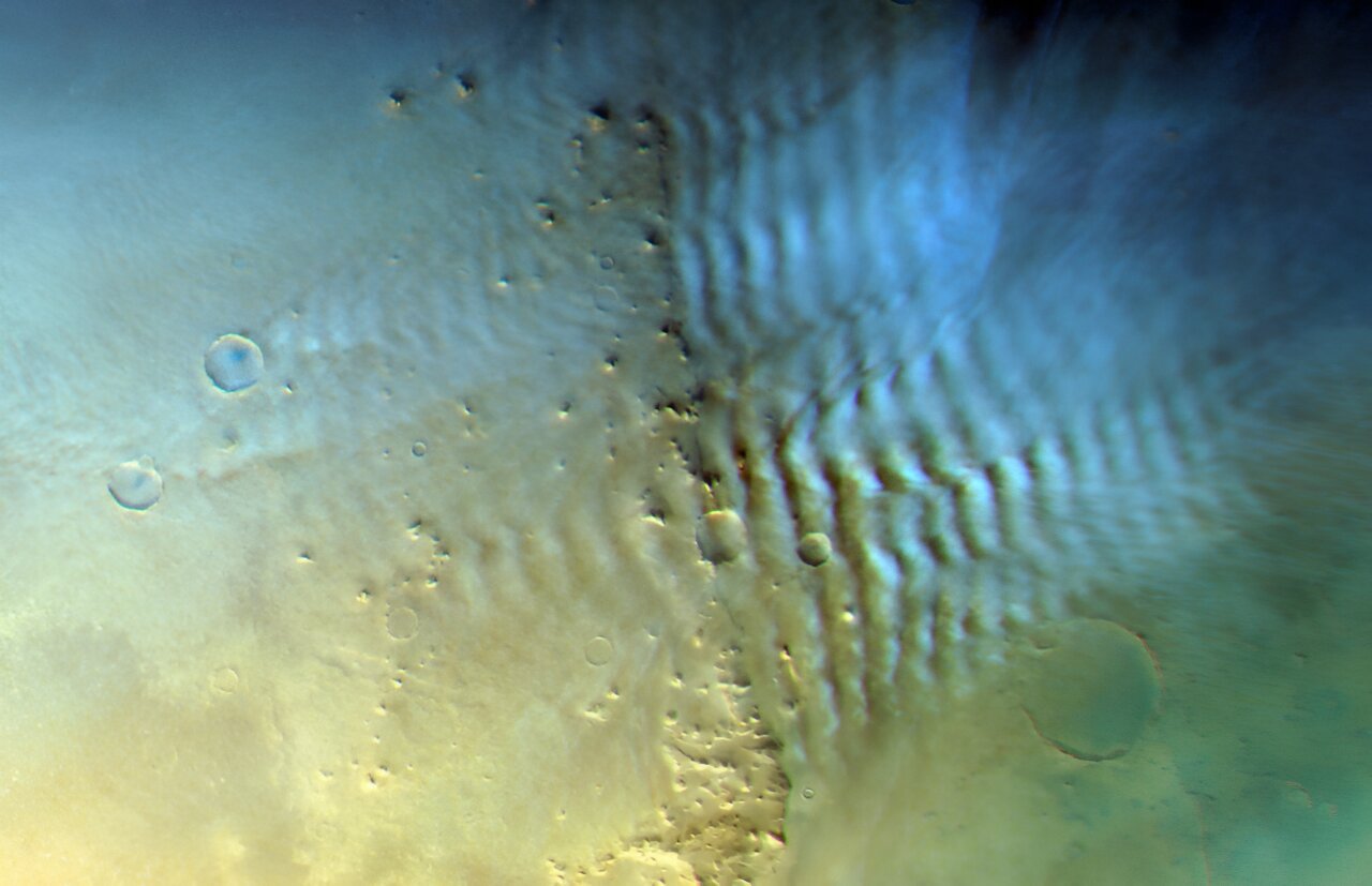 Lee waves are a unique type of cloud formed when wind meets obstacles, creating wave patterns on the downwind, or 'leeward,' side. The shape of these waves is influenced by the geometry of the obstacles they encounter. Credit: ESA/DLR/FU Berlin.