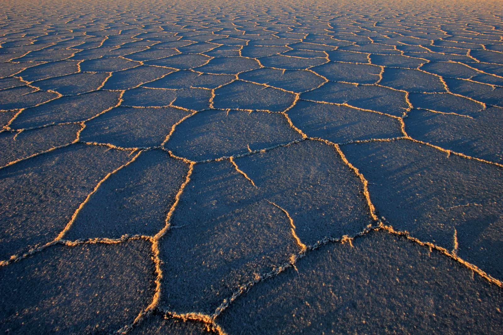 Beneath Salar de Uyuni’s iconic salt crust lies a highly concentrated layer of brine, rich in dissolved salts. Credit: Curiosmos.