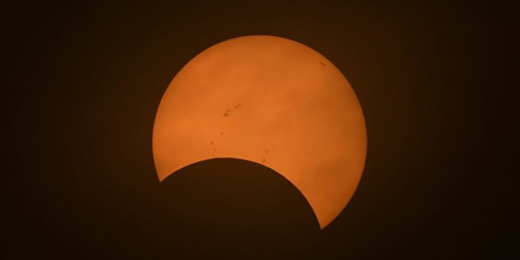 The eclipse begins with the appearance of a small 'bite' gradually being taken out of the Sun's surface.