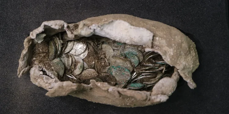 Archaeologists discovered the coins carefully enclosed in a cloth and lead wrapping. (Image credit: Oxford Cotswold Archaeology).